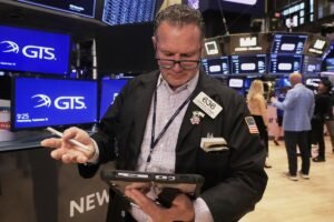 World shares are mostly up after US stocks inch to more records as inflation slows and Oracle soars